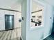 View into the kitchen with a stainless steel fridge, white cabinets, and sleek design at 4437 Janice Dr, Snellville, GA 30039