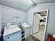 Charming laundry room featuring wood-look floors and modern washer and dryer at 4437 Janice Dr, Snellville, GA 30039