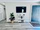 Bright living room features modern decor and a wall-mounted television at 4437 Janice Dr, Snellville, GA 30039