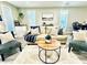 Cozy living room featuring comfortable seating, a wooden coffee table, and natural light at 4437 Janice Dr, Snellville, GA 30039