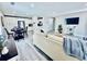 Open-concept living area with modern kitchen access, stylish seating, and wall-mounted TV at 4437 Janice Dr, Snellville, GA 30039