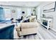 Bright and open living space with modern flooring, neutral tones, and comfortable seating at 4437 Janice Dr, Snellville, GA 30039