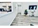 Open-concept living area with modern flooring, wall-mounted TV, and stylish decor at 4437 Janice Dr, Snellville, GA 30039