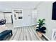 Open concept living space with wood floors, stylish decor, and access to the kitchen at 4437 Janice Dr, Snellville, GA 30039