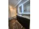 Modern bathroom with dual sinks, granite countertop, illuminated mirrors, and a shower-tub combination at , Union City, GA 30349