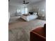 Spacious main bedroom featuring plush carpet, a ceiling fan, and a large bed at , Union City, GA 30349
