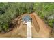 New construction home featuring a concrete driveway and lush surrounding greenery at 1408 Campbell Rd, Covington, GA 30014