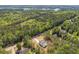 An aerial view of a property with an extremely densely populated tree perimeter at 1408 Campbell Rd, Covington, GA 30014