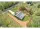 Beautiful aerial shot of a secluded home surrounded by mature trees and an expansive driveway at 1408 Campbell Rd, Covington, GA 30014