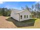 Back view of home featuring white siding, black gutters, and a lawn at 1408 Campbell Rd, Covington, GA 30014