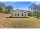 Wide view of backyard of home with manicured lawn at 1408 Campbell Rd, Covington, GA 30014