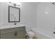 Bathroom featuring stylish vanity and tub/shower combo at 1408 Campbell Rd, Covington, GA 30014