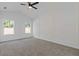 Bedroom with large windows, ceiling fan, and trim detail on the walls at 1408 Campbell Rd, Covington, GA 30014