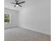 Bedroom with a ceiling fan and large window at 1408 Campbell Rd, Covington, GA 30014