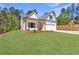 A shot of the front of a modern home with an attached garage and well manicured lawn at 1408 Campbell Rd, Covington, GA 30014