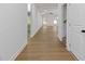 Bright hallway featuring hardwood floors leading into a spacious living area with lots of natural light at 1408 Campbell Rd, Covington, GA 30014