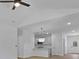 View of a living space showing a light colored bar, modern pendant lights and stainless appliances at 1408 Campbell Rd, Covington, GA 30014