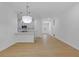 Open concept living area showcasing the seamless connection to the kitchen, with modern finishes and hardwood floors at 1408 Campbell Rd, Covington, GA 30014