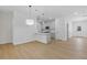 Open concept living area showcasing the seamless connection to the kitchen, with modern finishes and hardwood floors at 1408 Campbell Rd, Covington, GA 30014