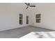 Covered patio featuring white siding and ceiling, with view of backyard at 1408 Campbell Rd, Covington, GA 30014