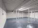 Unfinished basement with concrete floors and utility poles at 3984 Earney Rd, Woodstock, GA 30188