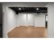 Finished basement with black ceiling and wood floors at 3984 Earney Rd, Woodstock, GA 30188