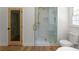 Updated bathroom with tiled shower, frameless glass door, and updated fixtures at 3984 Earney Rd, Woodstock, GA 30188