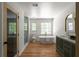Bright and spacious bathroom features hardwood floors, a standalone tub, and a modern vanity at 3984 Earney Rd, Woodstock, GA 30188