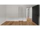 The bedroom features wood floors, closet, and a dark accent door at 3984 Earney Rd, Woodstock, GA 30188