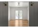 Bonus room featuring hardwood floors and french door access to the outdoors at 3984 Earney Rd, Woodstock, GA 30188
