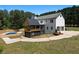 Stunning farmhouse-style home with a private pool and covered patio area above the garage at 3984 Earney Rd, Woodstock, GA 30188