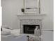 Cozy living room fireplace featuring stone surround, decorative mantel, and neutral-toned decor at 3984 Earney Rd, Woodstock, GA 30188