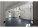 A spacious two car garage features epoxy floor, window, and insulated garage door at 3984 Earney Rd, Woodstock, GA 30188