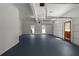 Spacious garage with painted floor, automatic door, windows and separate entry door at 3984 Earney Rd, Woodstock, GA 30188