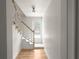 Welcoming hallway with stairway and natural light from a window at 3984 Earney Rd, Woodstock, GA 30188