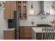 Modern kitchen features stainless steel appliances, custom cabinets, and a spacious island with stylish seating at 3984 Earney Rd, Woodstock, GA 30188