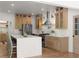 Modern kitchen with a large island, stainless steel appliances, and stylish light wood cabinetry at 3984 Earney Rd, Woodstock, GA 30188