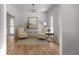 Cozy sitting room with neutral furnishings, hardwood floors, and bright natural light at 3984 Earney Rd, Woodstock, GA 30188