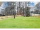 Expansive backyard featuring a well-maintained lawn and a sturdy wooden fence for privacy and security at 4101 Brookview Se Dr, Atlanta, GA 30339