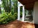 Backyard features a covered flagstone patio supported by white columns with a wood ceiling at 4101 Brookview Se Dr, Atlanta, GA 30339