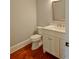 Powder room with a vanity with white cabinets and a wood-framed mirror at 4101 Brookview Se Dr, Atlanta, GA 30339