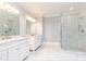 Bathroom showcasing double vanities, marble floors, and large glass walk-in shower at 4101 Brookview Se Dr, Atlanta, GA 30339