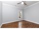 This bedroom features hardwood floors, a ceiling fan, a window, and neutral colored walls at 4101 Brookview Se Dr, Atlanta, GA 30339