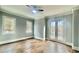 Bedroom with beautiful hardwood floors, white trim, and large windows at 4101 Brookview Se Dr, Atlanta, GA 30339