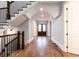 Elegant entryway featuring hardwood floors, archway, staircase with wrought iron railing, and natural light at 4101 Brookview Se Dr, Atlanta, GA 30339