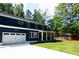 Charming two-story home with a spacious driveway, attached garage and inviting covered front porch at 4101 Brookview Se Dr, Atlanta, GA 30339