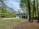 Attractive two-story home featuring a spacious driveway, attached garage, and charming covered front porch at 4101 Brookview Se Dr, Atlanta, GA 30339