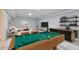 Basement game room with pool table, bar, recessed lighting, and L-shaped sofa at 4101 Brookview Se Dr, Atlanta, GA 30339