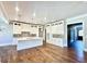 Open-concept kitchen featuring a kitchen island with white cabinets and hardwood floors at 4101 Brookview Se Dr, Atlanta, GA 30339