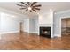Spacious living room features a fireplace, decorative ceiling fan and hardwood floors at 4101 Brookview Se Dr, Atlanta, GA 30339